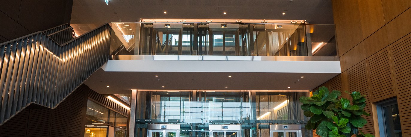Lit stair and glazed lobby at TRN House Office Building