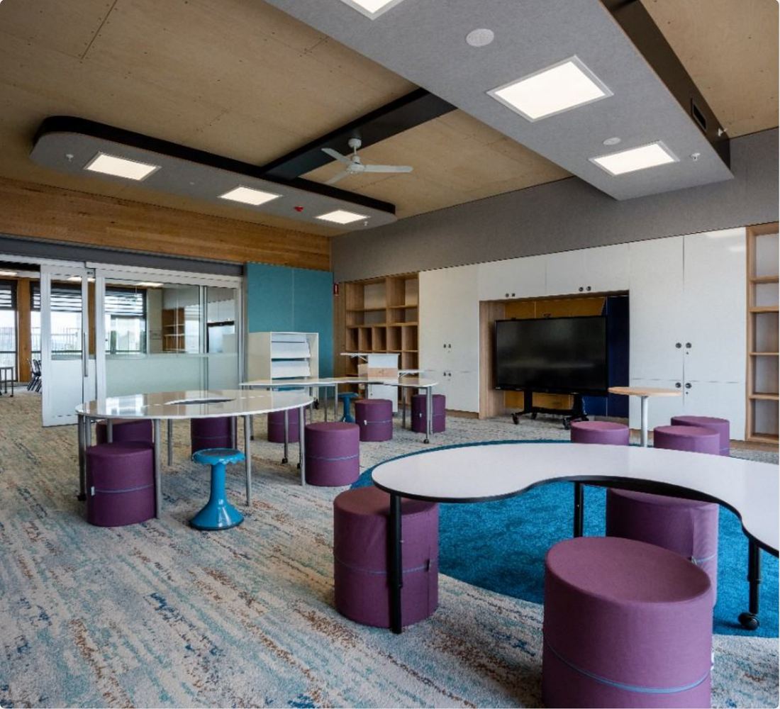 Open-plan collaboration zone with DALI-2 controlled panel lighting