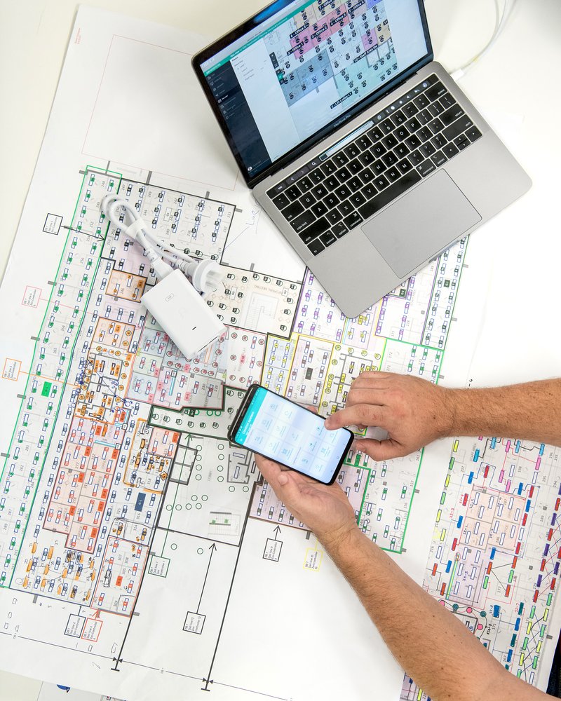 A systems integrator working a DALI lighting plan against the zencontrol app